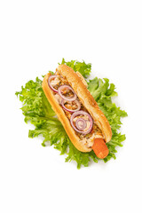 hot dog on a white isolated background. fried sausage in sauce