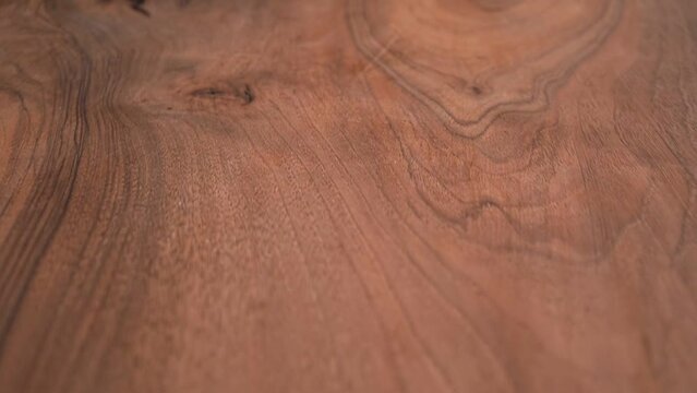 the wooden surface of the table is slowly shown. slow motion video. Wood texture background. High quality Full HD video recording