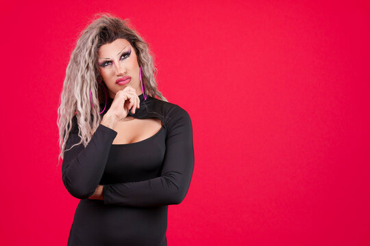 Transgender person with hand on chin and thoughtful expression