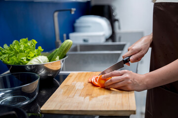 Asian woman making healthy food salad To take care health eat food that are beneficial to body Do it with cleanliness such as washing your hand before doing symptoms washing vegetables before eating