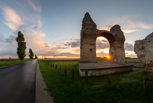 Panorama of the ruins of the triumphal arch Heathens' Gate in Carnuntum during sunset