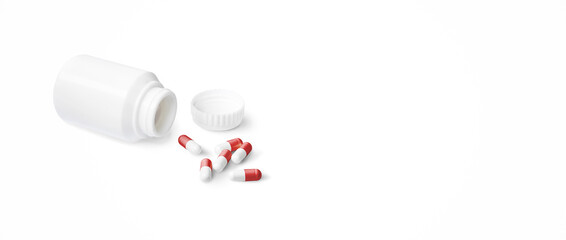 Capsule pills with red and white spilling out of pill bottle on white background, Panoramic banner with copy space, Medical treatment concept