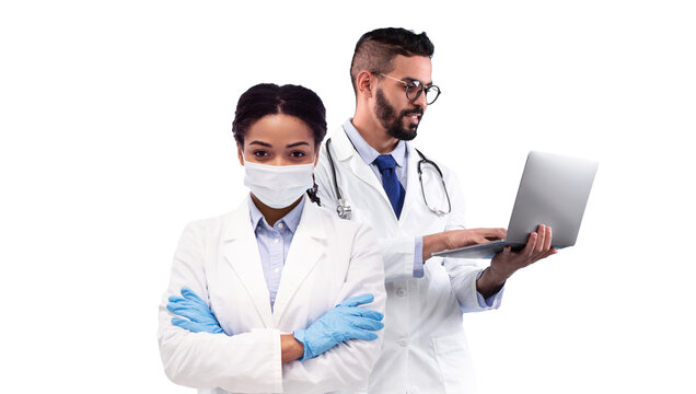 Composite Image For Healthcare Concept With Two Multiethnic Doctors In Uniform