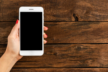 Female hands holding mobile phone with copyspace. Banner