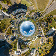 blue sphere inside overlooking old town, urban development, historic buildings and crossroads with cars. Transformation of spherical 360 panorama in abstract aerial view.
