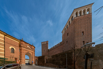 Fossano, Cuneo, Italy: cityscape with a view of the Porta di San Martino and the castle of the...