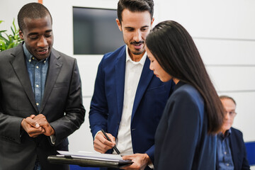 Multiracial business people in business meeting inside modern office