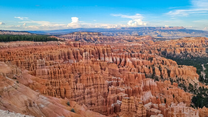 Panoramic aerial view of massive hoodoo sandstone rock formations in Bryce Canyon National Park, Utah, USA. Natural unique amphitheatre sculpted from the reddest rock of the Claron Formation. Awe