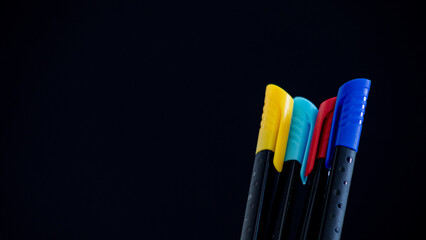 Close-up of pencils on yellow background with copy space