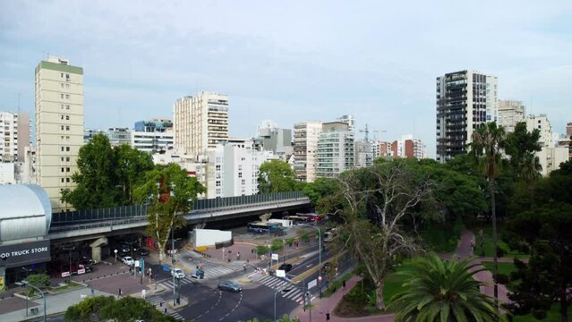 House buildings, road traffic with cars and bridge, view from drone on Belgrano Argentina architecture