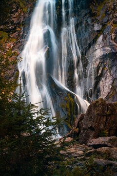 Vertical shot of the Powerscourt Waterfall in autumn in Portlaoise, County Laois, Ireland