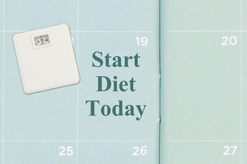 Start Diet Today message on a calendar with a scale