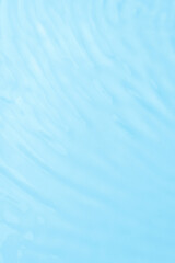 Waves on the surface of the water. gentle light waves, water, top view. Cyan, blue, transparent