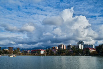 Lake view of the city skyline of Batumi with clouds in the background