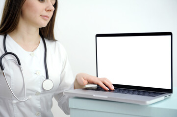 cropped shot of female doctor showing tablet with blank screen to patient at office. High quality photo