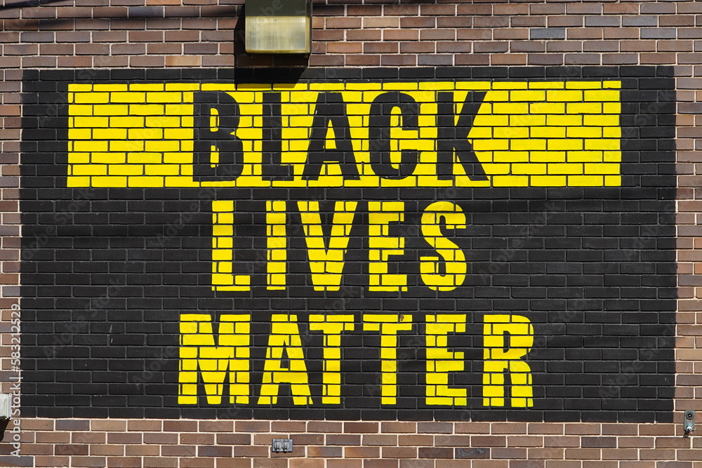 Wall mural Black Lives Matter memorial site outside on a brick wall in Ripon, Wisconsin.