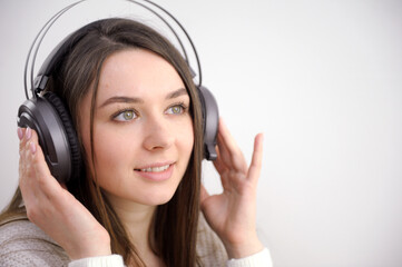 Cool teenager listening to music and dancing isolated on white background. High quality photo