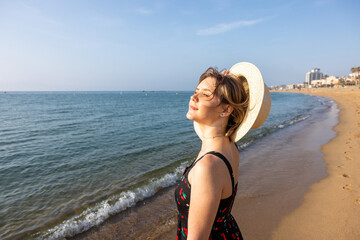 Beautiful serene young woman portrait at seaside