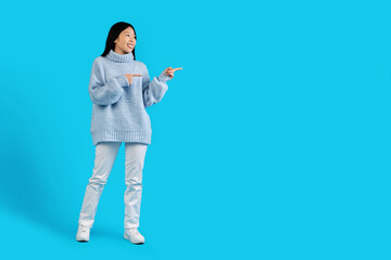 Attractive chinese woman in casual aiming at copy space