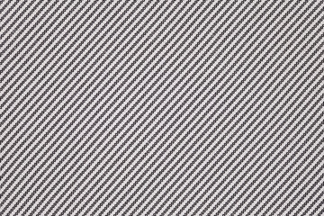 Lining fabric close-up, stitches diagonally with black threads on white, background wallpaper,...