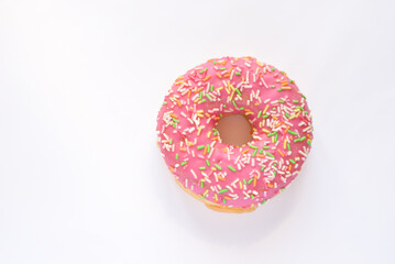Pink donut with sprinkles isolated on white background