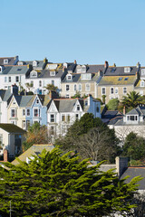 St. Ives, UK - close-up of group of traditional houses with trees