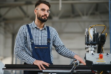 Factory worker. Man working on the production line.