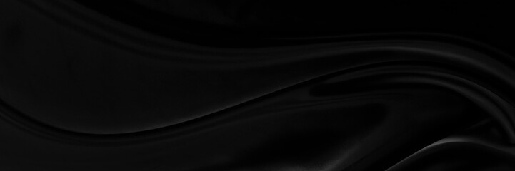 Black gray satin dark fabric texture luxurious shiny that is abstract silk cloth panorama background with patterns soft waves blur beautiful.