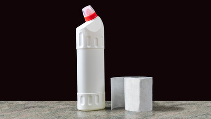 white plastic container for household chemicals and paper roll on a wooden surface - 583221108