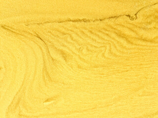 sand texture as a background. sand waves in the desert. golden sand for designers