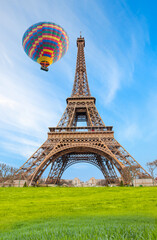 Hot air balloon flying over Eiffel tower - Paris, France