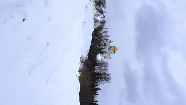 Belogorsky St. Nicholas Orthodox Missionary Monastery. Russia, Perm Krai, Belaya Gora. The temple on the hill in winter. Monastery on the background of snow. 4K