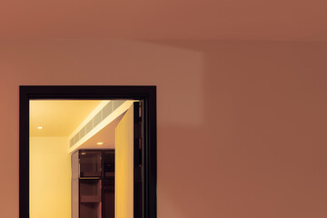 a door between pink and yellow room 