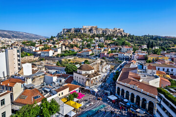 Fototapeta na wymiar Partial, aerial view of the historical center of Athens, Greece. From front to back you can see, Monastiraki, Plaka and the Acropolis