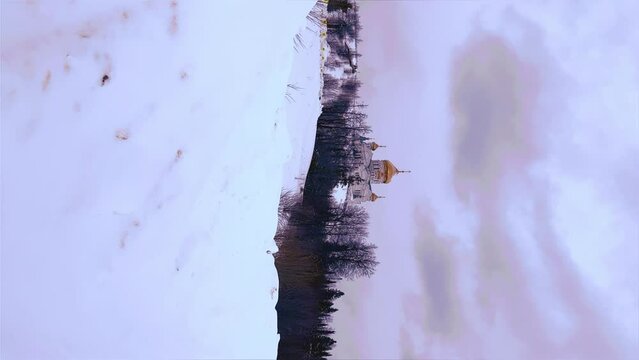 Belogorsky St. Nicholas Orthodox Missionary Monastery. Russia, Perm Krai, Belaya Gora. The temple on the hill in winter. Monastery on the background of snow. 4K