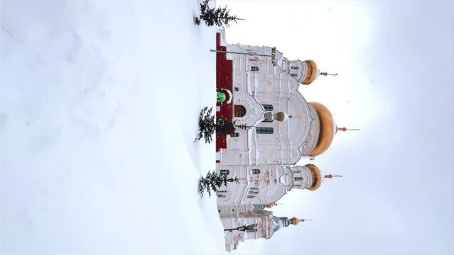 Belogorsky St. Nicholas Orthodox Missionary Monastery. Russia, Perm Krai, Belaya Gora. The temple on the hill in winter. Monastery on the background of snow. 4K