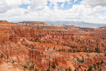 Fototapeta na wymiar Scenic aerial view of massive hoodoo sandstone rock formation towers on Navajo trail in Bryce Canyon National Park, Utah, USA. Natural unique amphitheatre in summer. Dark clouds emerging to storm