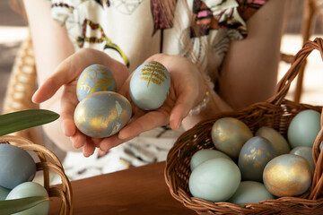 painted eggs in the hands of a girl for easter, spring holiday