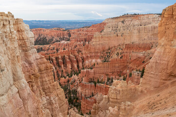 Panoramic aerial view of massive hoodoo sandstone rock formations in Bryce Canyon National Park, Utah, USA. Natural unique amphitheatre sculpted from the reddest rock of the Claron Formation. Awe