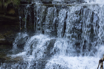 Waterfall outdoors over rocks