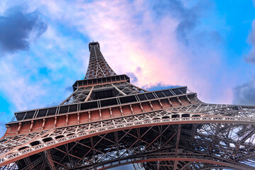 The Eiffel Tower in Paris against the backdrop of a beautiful evening sky.