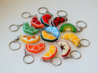 A lot of colorful key chains on a white background