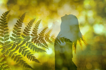 Young happy joyful woman finding hope feeling free in nature looking up to the sky.