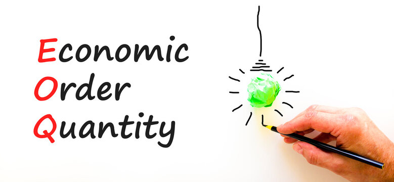 EOQ economic order quantity symbol. Concept words EOQ economic order quantity on paper on a beautiful white background. Green light bulb icon. Business EOQ economic order quantity concept. Copy space.