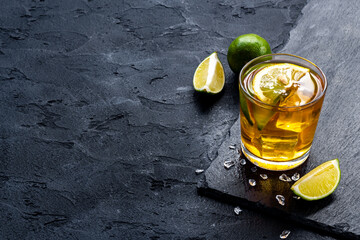 Glass of alcoholic cocktail with oganges and ice. Alcoholic drinks background - obrazy, fototapety, plakaty