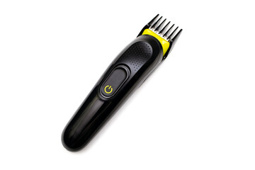 A trimmer razor for cutting and modeling hair lies on a white isolated background. Electric shaver...