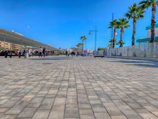 Santa Pola promenade view with people walking, Spain