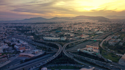 Aerial drone multilevel junction overpass highway with National toll road at rush hour with...