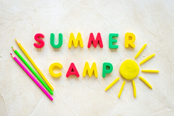 Camping concept. Color text Summer Camp with sun