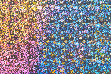 Holographic paper with a geometric pattern. Background or backdrop